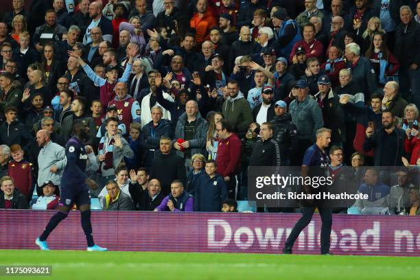 Aston Villa fans wave at Arthur Masuaku of West Ham United after he was sent off during the Premier League match between Aston Villa and West Ham...