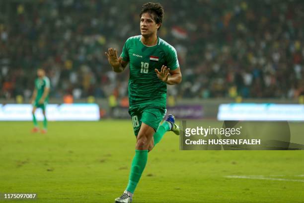 Iraq's forward Mohanad Ali celebrates his goal during the World Cup Qatar 2022 Group C qualification football match between Iraq and Hong Kong at the...