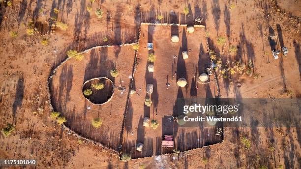 aerial view of txitundo hulo, village kimbos, surrounded by village fence, in angola - africa village stock pictures, royalty-free photos & images