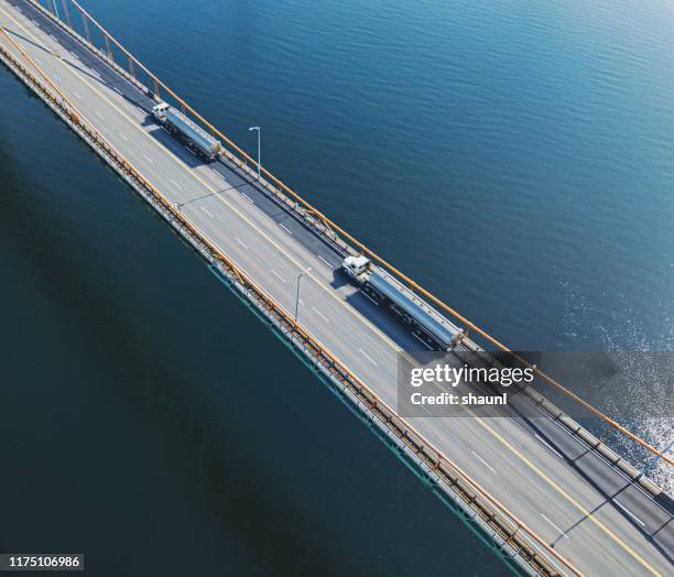 oil tankers on bridge - 2019 truck stock pictures, royalty-free photos & images