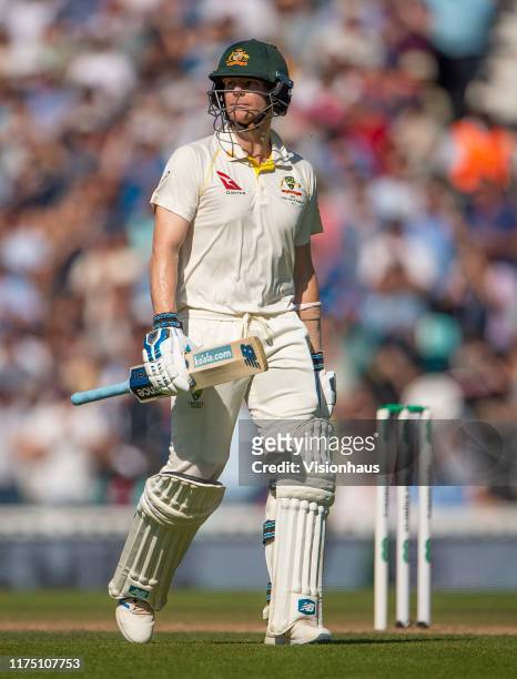 Steve Smith of Australia walks from the pitch after losing his wicket to Stuart Broad of England during day four of the 5th Specsavers Ashes Test...