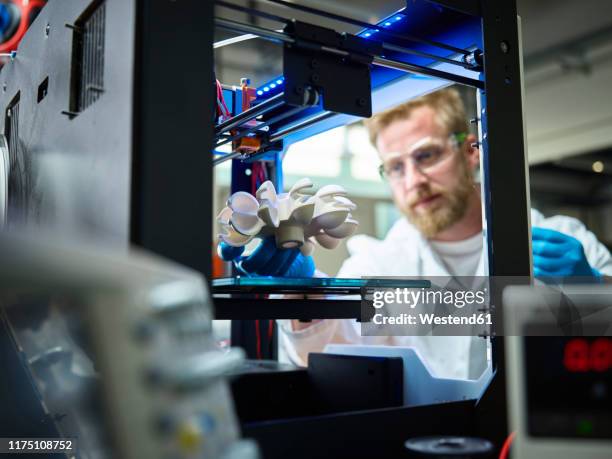 technician with turbine wheel being printed in 3d printer - 3d printers stock pictures, royalty-free photos & images