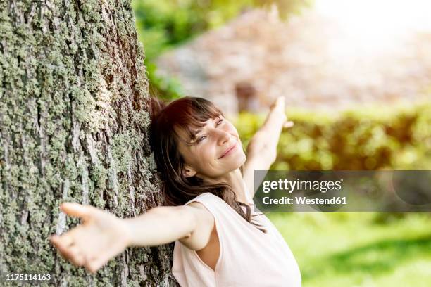Pin Against Tree 1,306 Woman Leaning Against Tree Trunk Portrait Stock Photos, High-Res ...