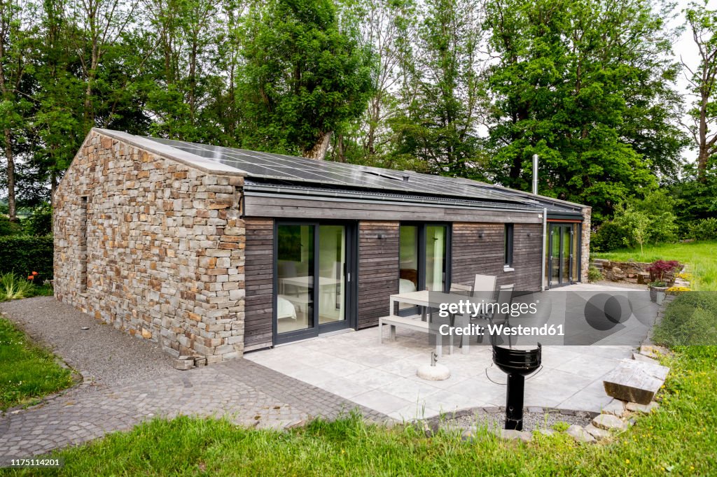 Detached house with solar panels on the roof