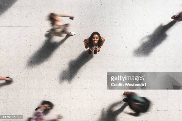 portrait of happy young woman looking up, top view - one person in focus stock pictures, royalty-free photos & images