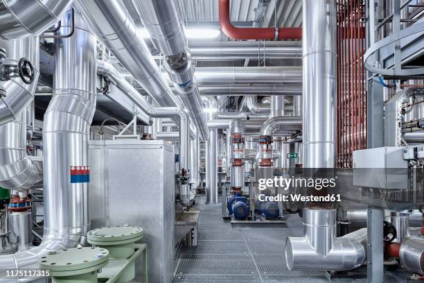 pipeworks with insulation in a technical room - district heating stock pictures, royalty-free photos & images