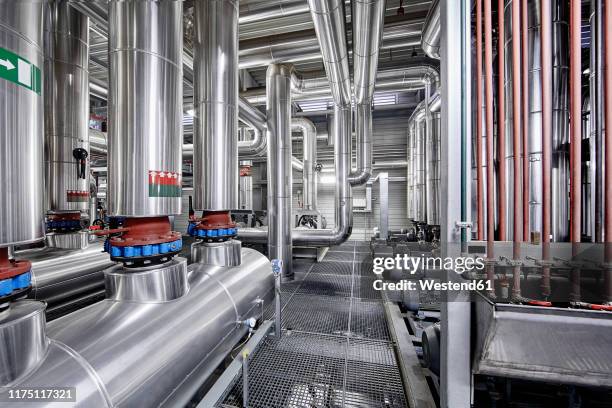 pipeworks with insulation in a technical room - district heating stock pictures, royalty-free photos & images