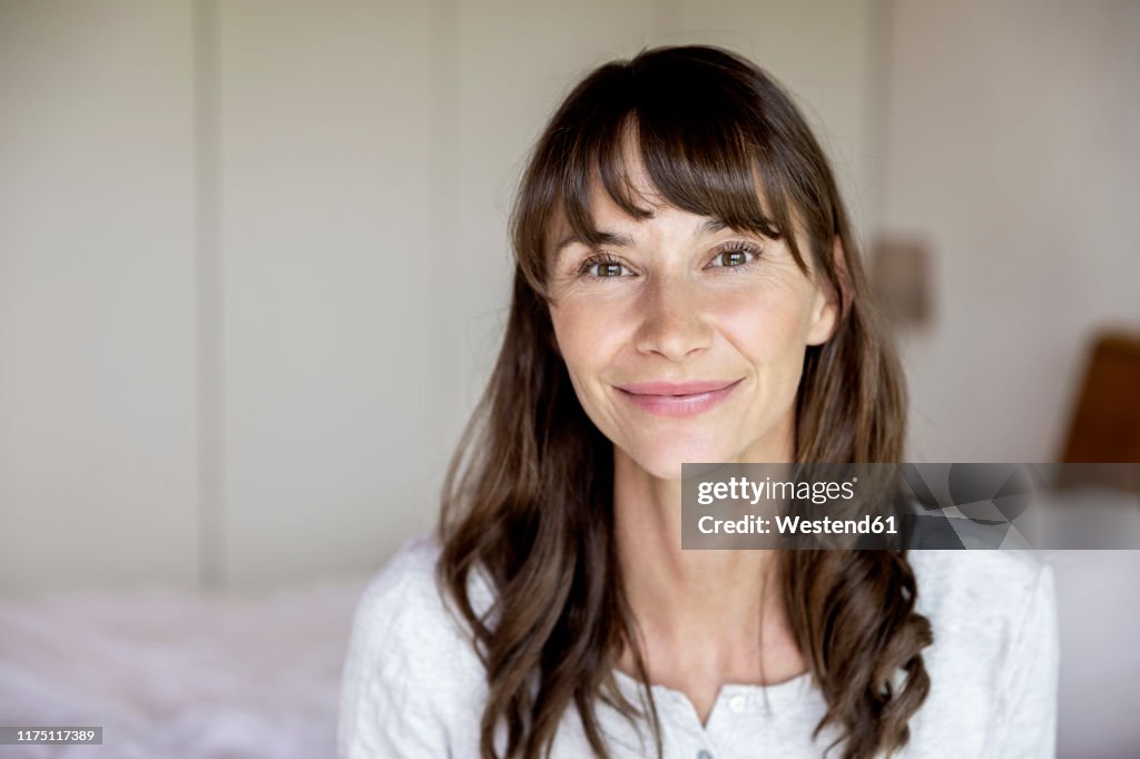 Portrait of smiling woman at home