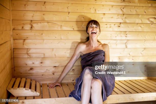 portrait of laughing woman in a sauna - steam room stock pictures, royalty-free photos & images