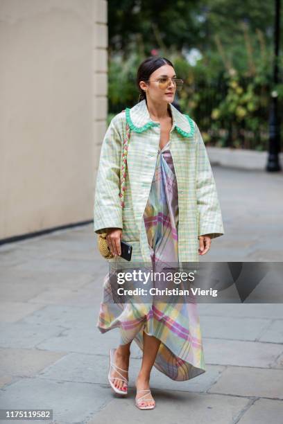 Guest is seen wearing silk dress outside Erdem during London Fashion Week September 2019 on September 16, 2019 in London, England.