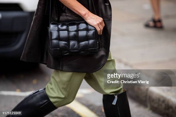 Chloe Harrouche is seen wearing black leather jacket, green pants, black boots, outside Erdem during London Fashion Week September 2019 on September...