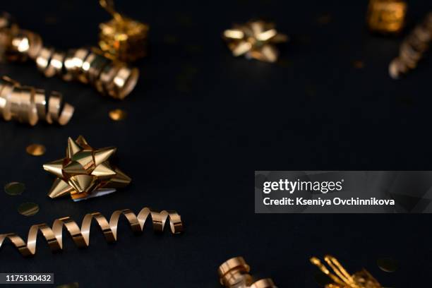 christmas holiday composition, ornament. festive creative gold pattern, spruce branches, xmas tree, xmas golden decor holiday ball with gift and ribbon on wooden brown background. flat lay, top view - ball on a table stockfoto's en -beelden