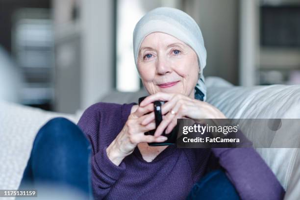 portrait of a confident woman with cancer - cancer patient portrait stock pictures, royalty-free photos & images