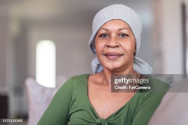 porträt einer kontemplativen krebskranken frau - cancer patient stock-fotos und bilder