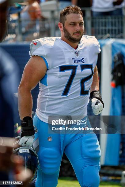 David Quessenberry of the Tennessee Titans leaves the field after the first half of a game against the Indianapolis Colts at Nissan Stadium on...