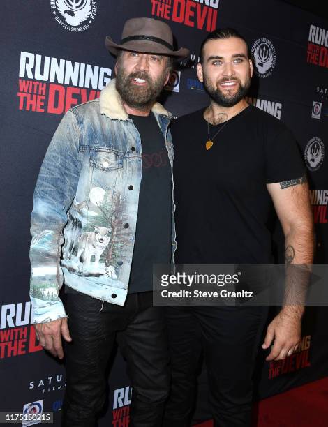 Nicolas Cage and son Weston Coppola Cage arrives at the Premiere Of Quiver Distribution's "Running With The Devil" at Writers Guild Theater on...