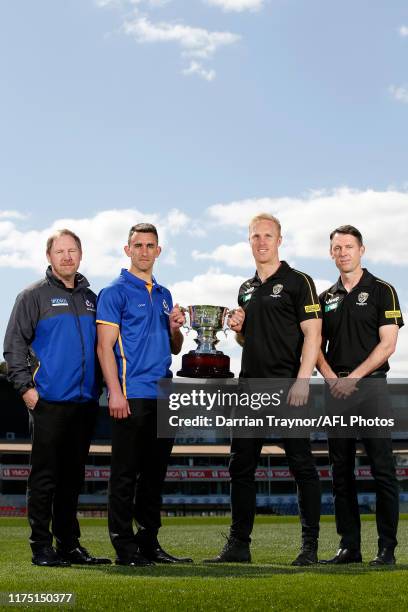 Andy Collins, Adam Macron , Steven Morris and Craig McRae pose for a photo during the VFL Grand Final Press Conference at Ikon Park on September 17,...