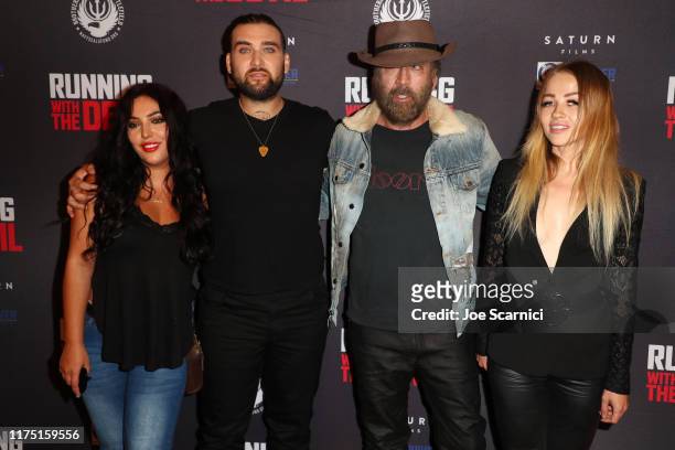 Weston and Nicolas Cage and Erika Koike arrive at the Premiere of Quiver Distribution's "Running With The Devil" at Writers Guild Theater on...