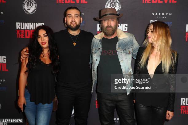 Weston and Nicolas Cage and Erika Koike arrive at the Premiere of Quiver Distribution's "Running With The Devil" at Writers Guild Theater on...