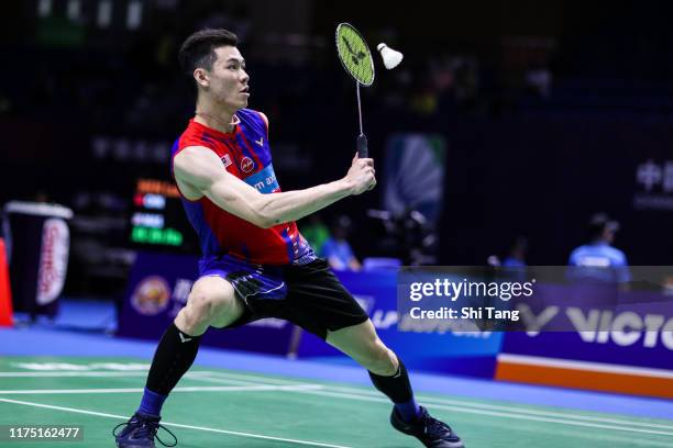 Lee Zii Jia of Malaysia competes in the Men's Singles first round match against Chen Long of China on day one of the China Open at Olympic Sports...