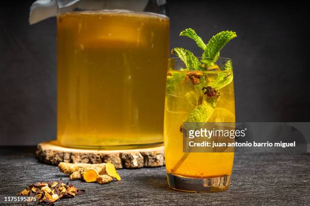 homemade fermented kombucha tea curcuma flavor. healthy natural drink with probiotic flavor. - kombucha ストックフォトと画像