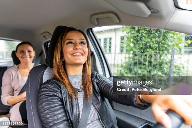 ridesharing - driver passenger stock pictures, royalty-free photos & images