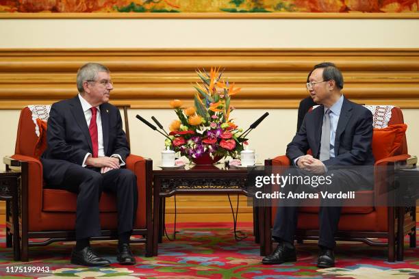 Chinese State Councilor Yang Jiechi talks to President of the International Olympic Committee Thomas Bach at Zhongnanhai on September 17, 2019 in...