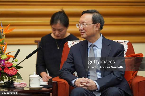 Chinese State Councilor Yang Jiechi talks to President of the International Olympic Committee Thomas Bach at Zhongnanhai on September 17, 2019 in...