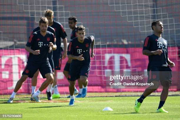 Thomas Mueller, Philippe Coutinho and Thiago Alcantara of FC Bayern Muenchen during a training session at Saebener Strasse training ground on...