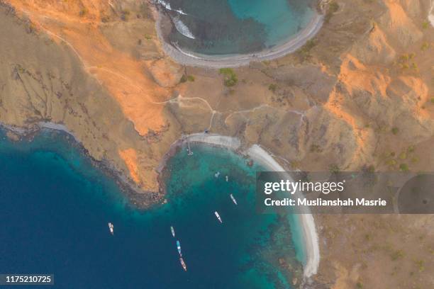 aerial view using drone view the middle of padar island at komodo national park located in east nusa tenggara, indonesia. - pulau komodo stock pictures, royalty-free photos & images