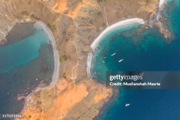 aerial view using drone view the middle of padar island at komodo national park located in east nusa tenggara, indonesia. - pulau komodo stock pictures, royalty-free photos & images