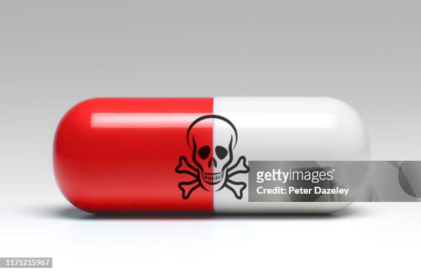 large capsule of dangerous medicine - sostanza tossica foto e immagini stock