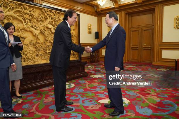 State Councilor Yang Jiechi shakes hands with Minister of the Presidency of the Dominican Republic Gustavo Montalvo on September 17, 2019 in...