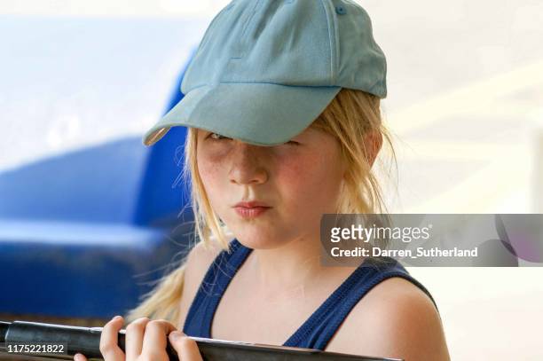 portrait of a scowling teenage girl wearing a baseball cap, canada - girl baseball cap stock pictures, royalty-free photos & images