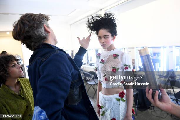 Model backstage ahead of a presentation in celebration of BoF China Prize 2018 winner Caroline Hu, held on partnership with Yu Holdings at The...