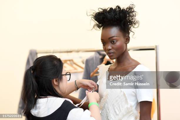 Model backstage ahead of a presentation in celebration of BoF China Prize 2018 winner Caroline Hu, held on partnership with Yu Holdings at The...