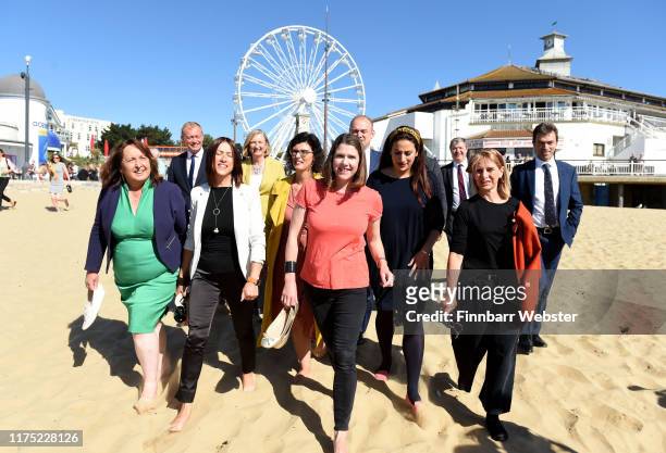 Liberal Democrat leader Jo Swinson and fellow MP's take a walk on Bournemouth beach before before she delivers her first leader's speech at the...