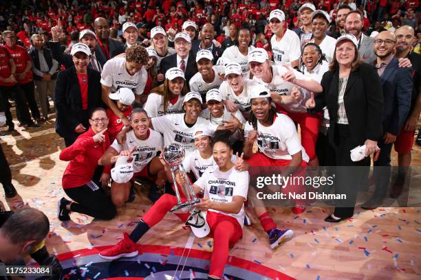 The the Washington Mystics pose for a photo with the WNBA Championship Trophy afterGame Five of the 2019 WNBA Finals on October 10, 2019 at St...