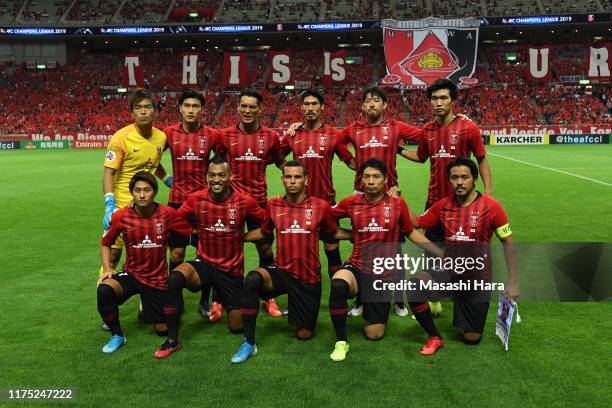 Players of Urawa Reds pose for the team photo prior to the AFC Champions League quarter final second leg match between Urawa Red Diamonds and...