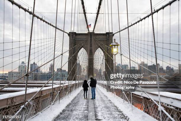 winter at the brooklyn bridge - brooklyn bridge winter stock pictures, royalty-free photos & images