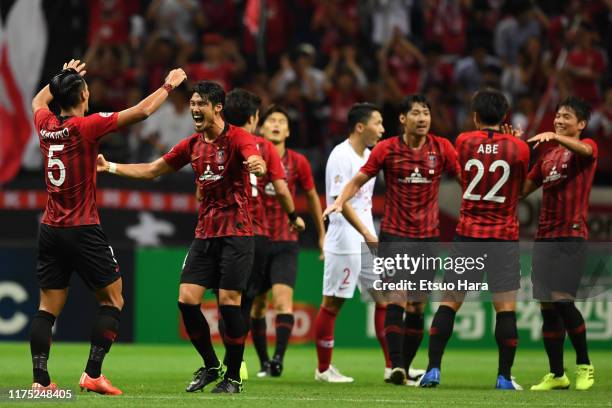 Players of Urawa Red Diamonds celebrate the victory at the end of the AFC Champions League quarter final second leg match between Urawa Red Diamonds...