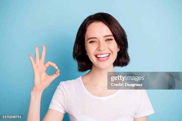 Close-up portrait of her she nice attractive lovely cheerful cheery girl showing ok-sign ad solution good choice isolated on bright vivid shine vibrant blue turquoise color background