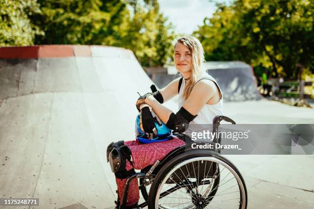 Portrait of disabled woman in wheelchair in skate park