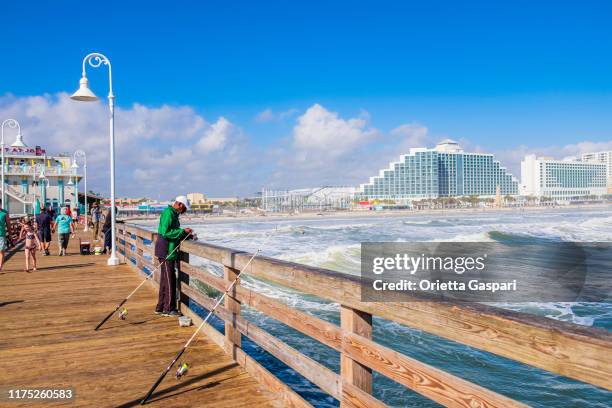 florida (us) - daytona beach boardwalk and pier - daytona beach boardwalk stock pictures, royalty-free photos & images