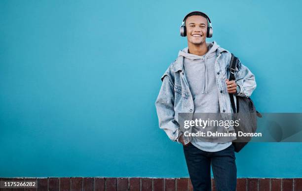 listen to some good music and get the good vibes going - man in denim jacket stock pictures, royalty-free photos & images