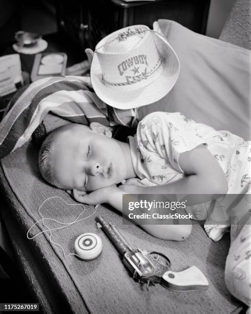 1950s BOY SLEEPING WITH TOYS COWBOY HAT CAP PISTOL YO-YO