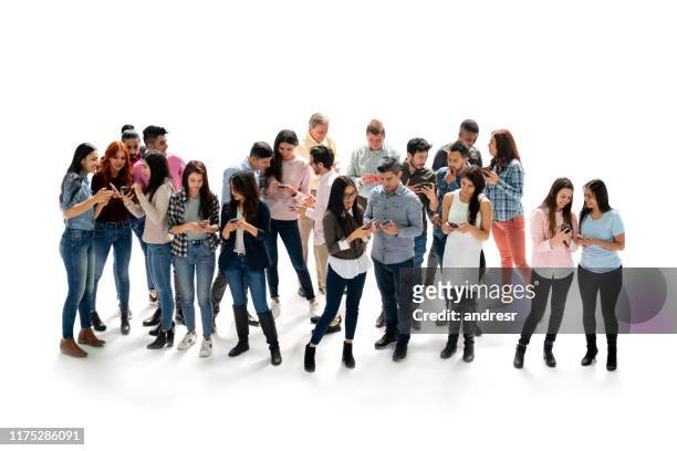 people looking at social media on their cell phones at the studio - large group of people white background stock pictures, royalty-free photos & images