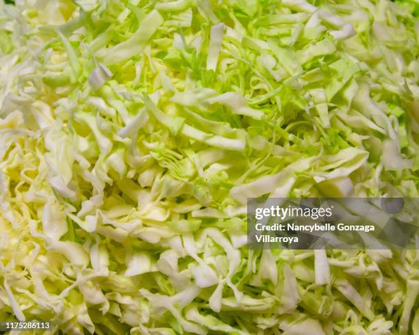 close up of raw shredded cabbage - coleslaw stock pictures, royalty-free photos & images