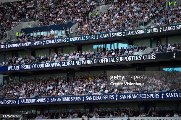 Multiple electronic screens illustrate Tottenham Hotspur fan clubs and global reach during the Premier League match between Tottenham Hotspur and...