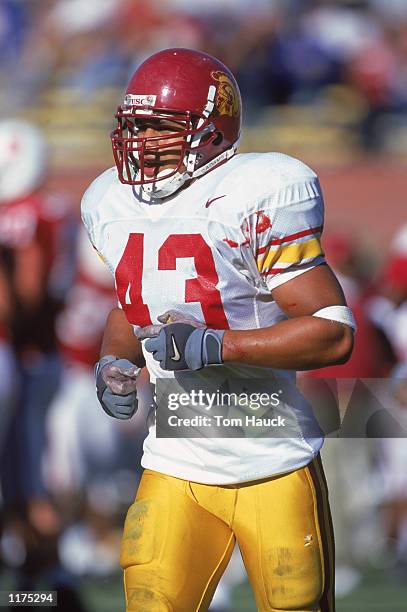 Troy Polamalu of University of Southern California Trojans jogs onto the field during a game against the Stanford Cardinal at Stanford Stadium on...